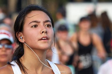 Committed Female Athlete Running In The Nike Woman’s Half Marathon, San Francisco, 2015.