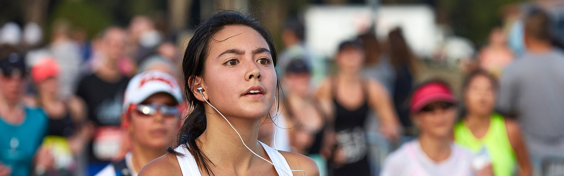 Committed Female Athlete Running In The Nike Woman’s Half Marathon, San Francisco, 2015.