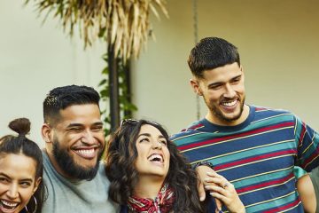 Cheerful multi-ethnic friends having fun in party