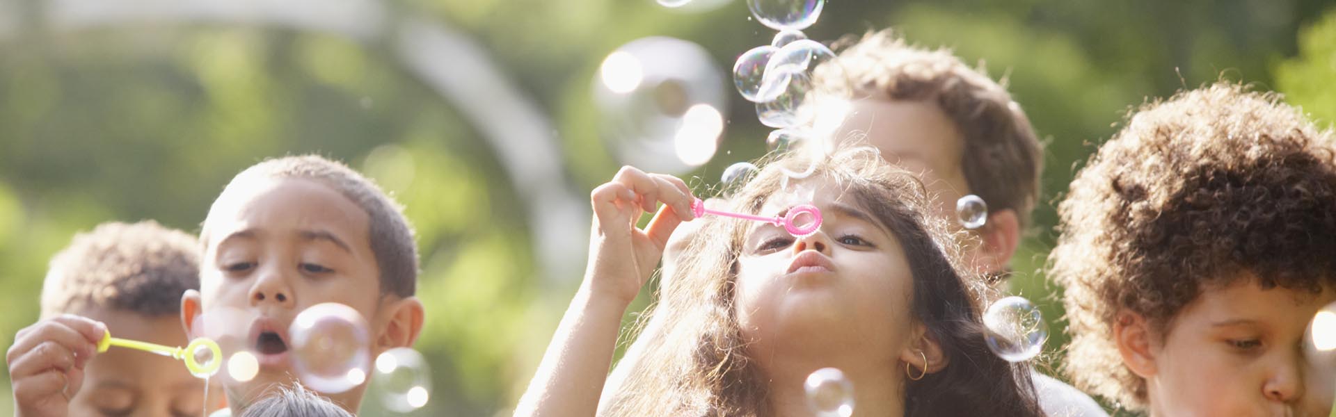 Children blowing bubbles.