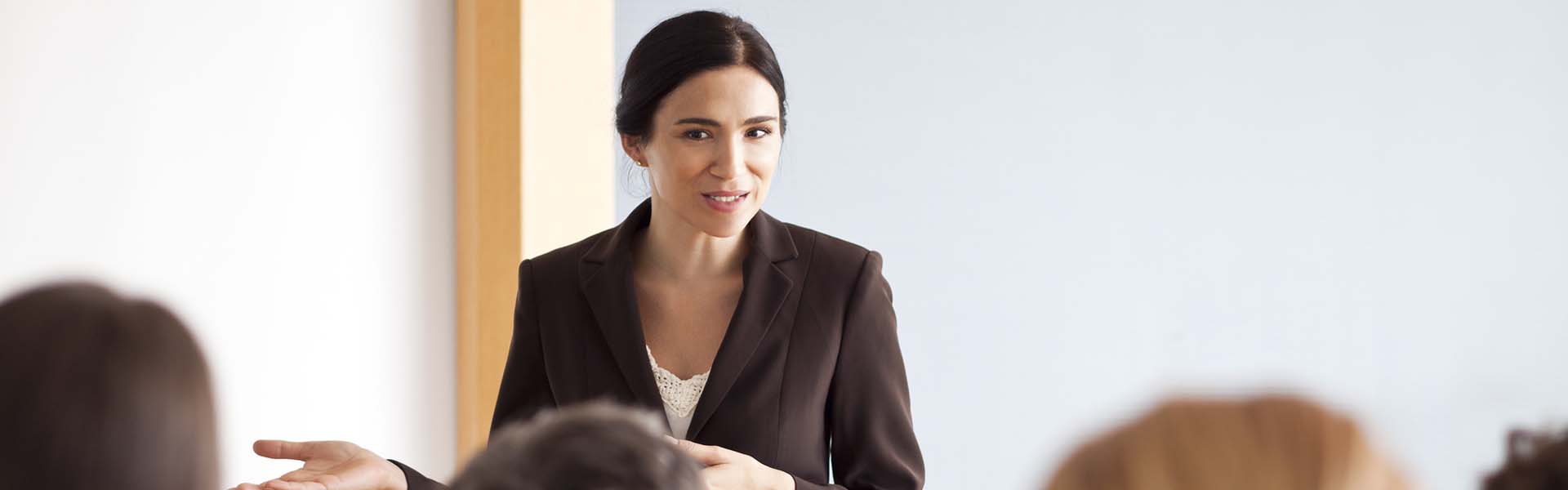 Businesswoman giving presentation at meeting