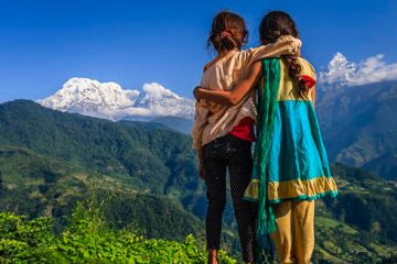 Nepali little girls looking at Annapurna South