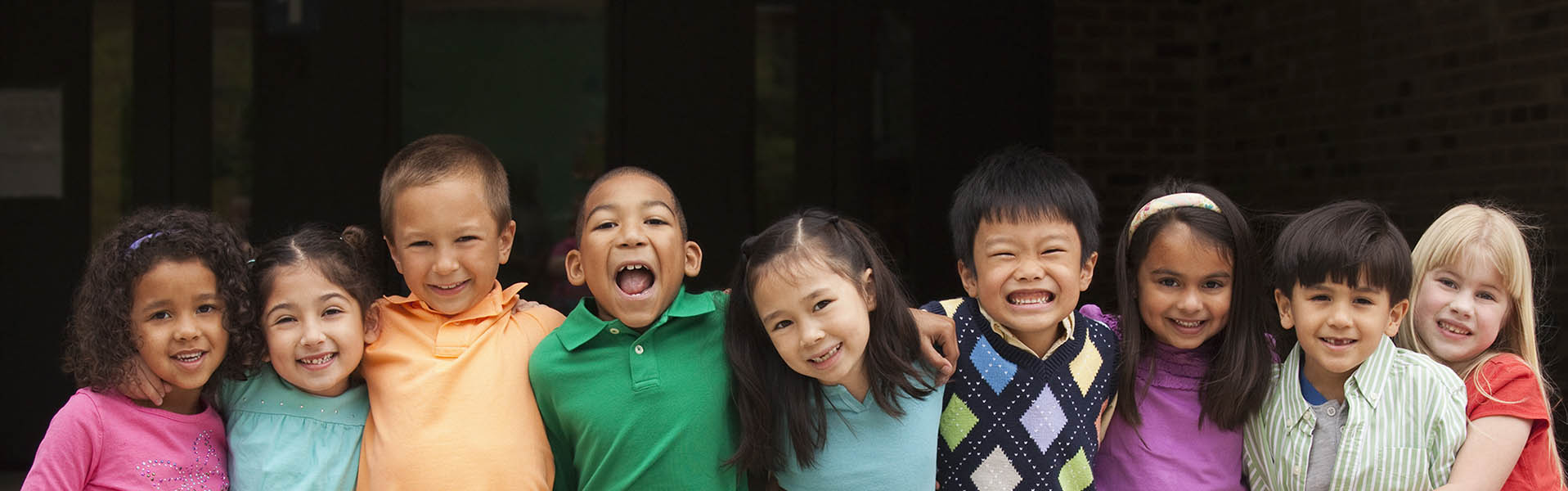 Diverse students standing together in a row