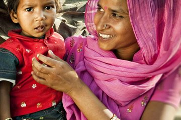 Real people from rural India: Happy parents with their children.