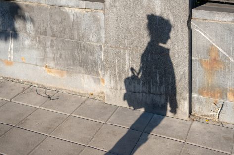 Shadow of a girl with a bag