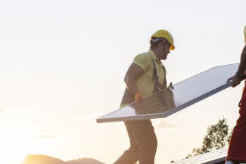 Installation of solar panels on a roof.