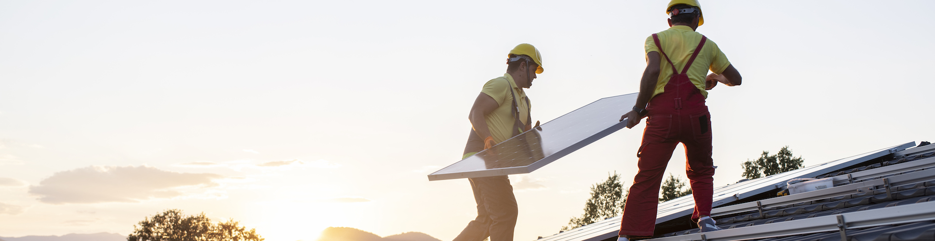 Installation of solar panels on a roof.