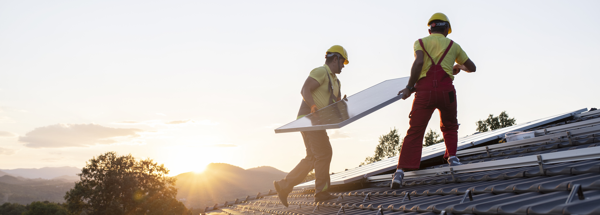 Installation of solar panels on a roof.