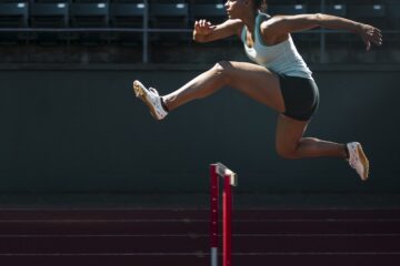 A runner taking on the hurdles.