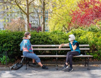 Women social distancing and wearing face mask in New York City.