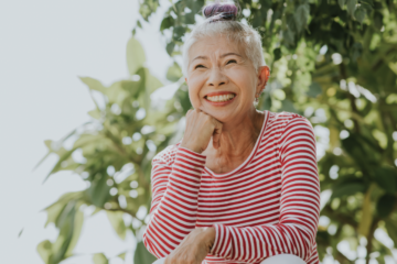 An elderly Thai woman smiling